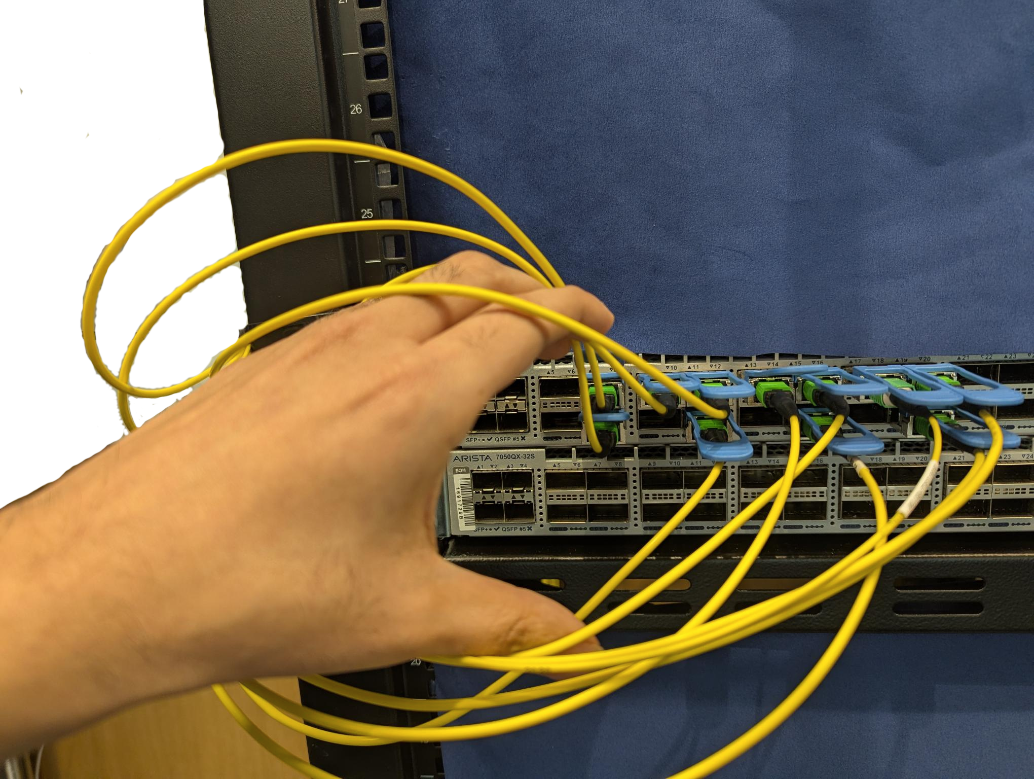 Human operator parting cables to reach a port
